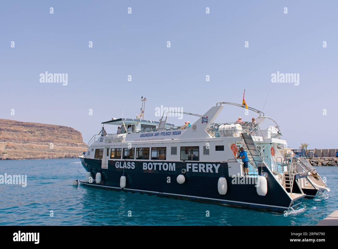 Glass Bottom Boat Tours Ferry leaving port in Mogan, Gran Canaria