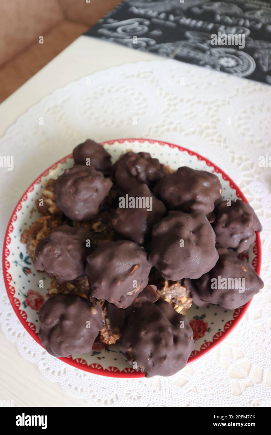 Homemade candy made from nuts and dried fruits. Some are covered in ...