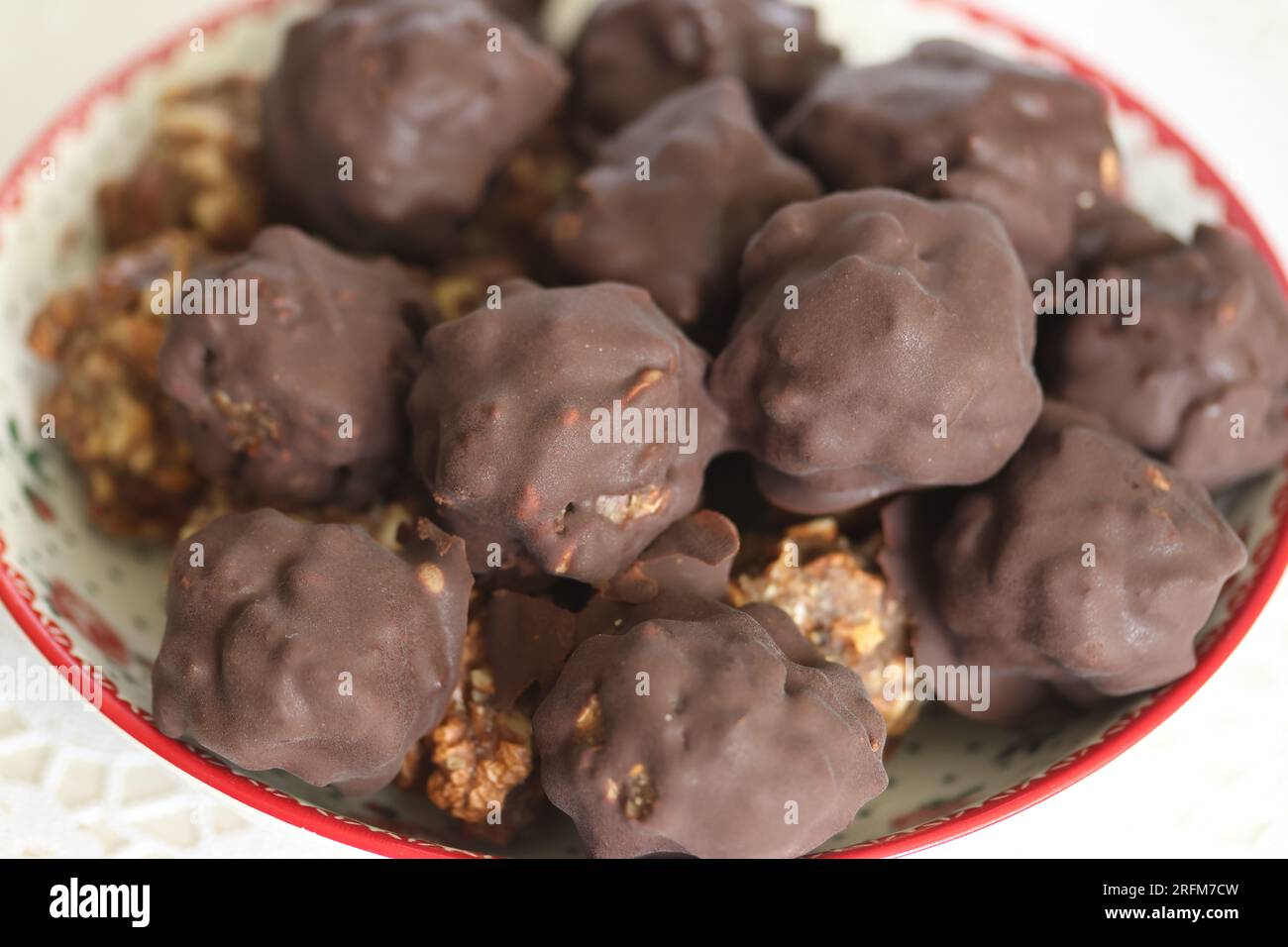 Homemade candy made from nuts and dried fruits. Some are covered in ...