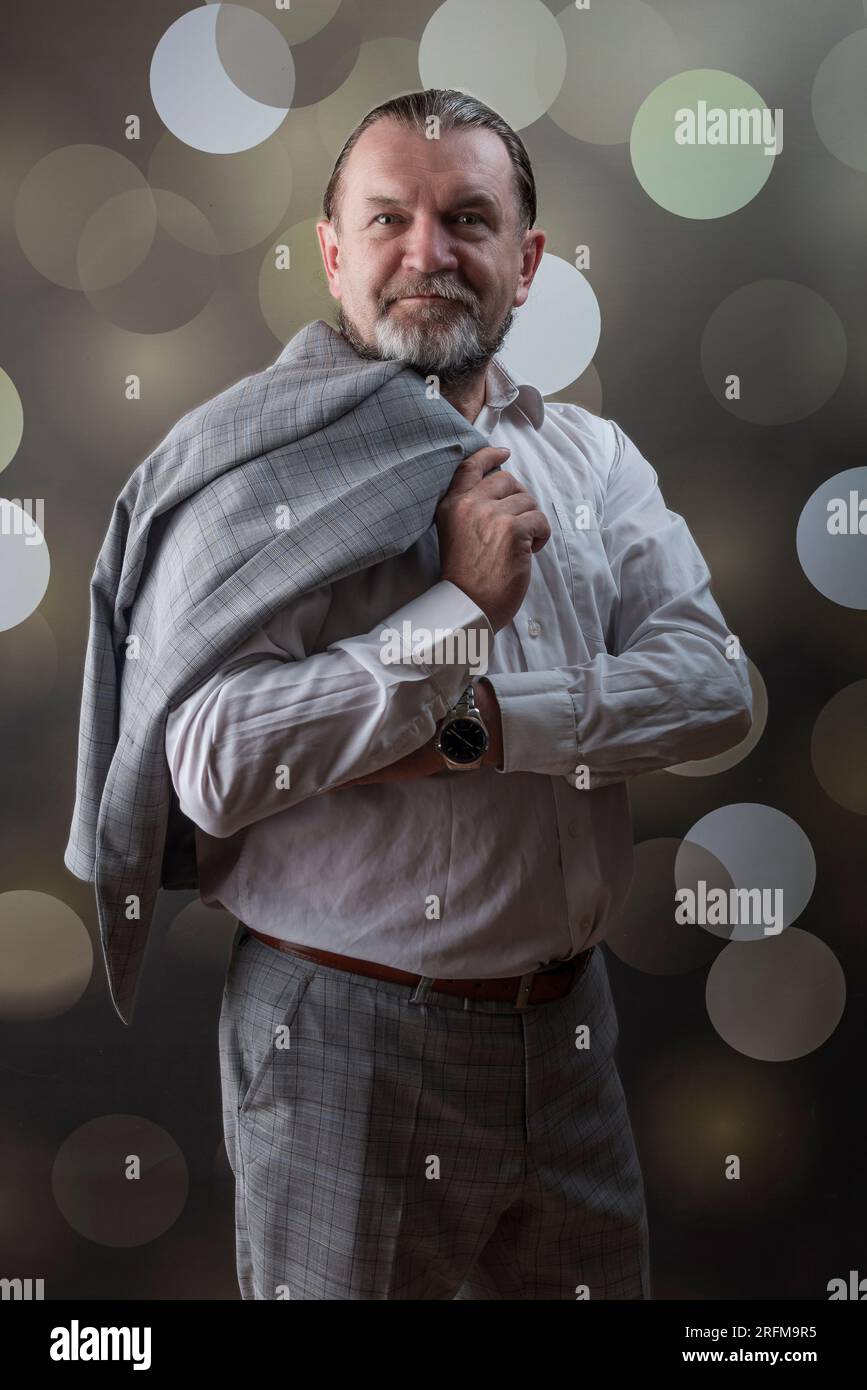 An old man wear bright clothes Stock Photo