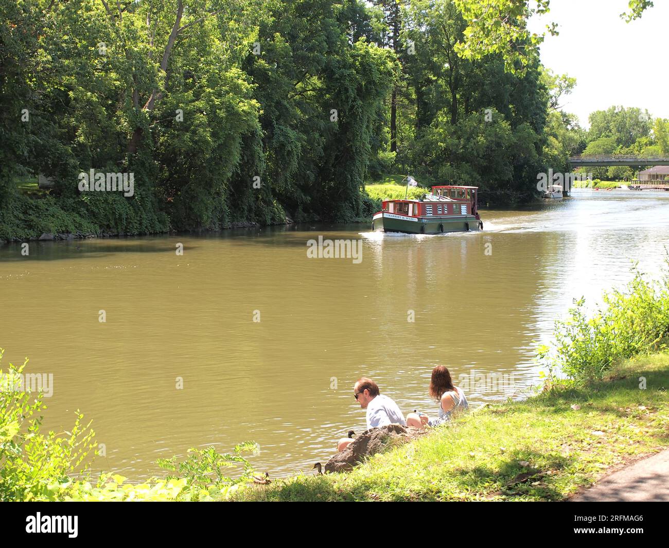 Scenes along the Erie Canal in Fairport, New York with canal boats and