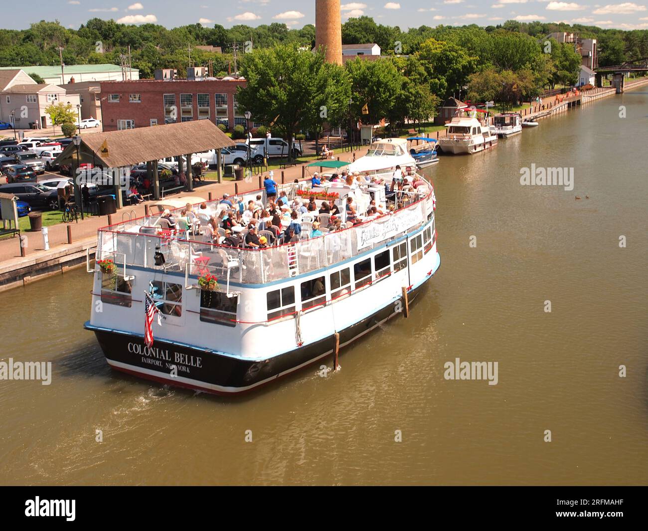Scenes along the Erie Canal in Fairport, New York with canal boats and