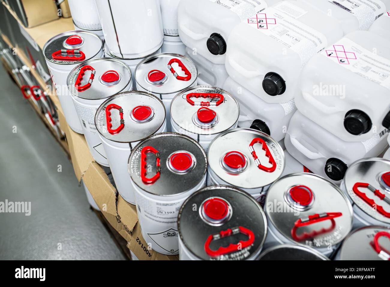 Flammable liquid in a metal canister in a storage room, research concept, handling of dangerous substances Stock Photo