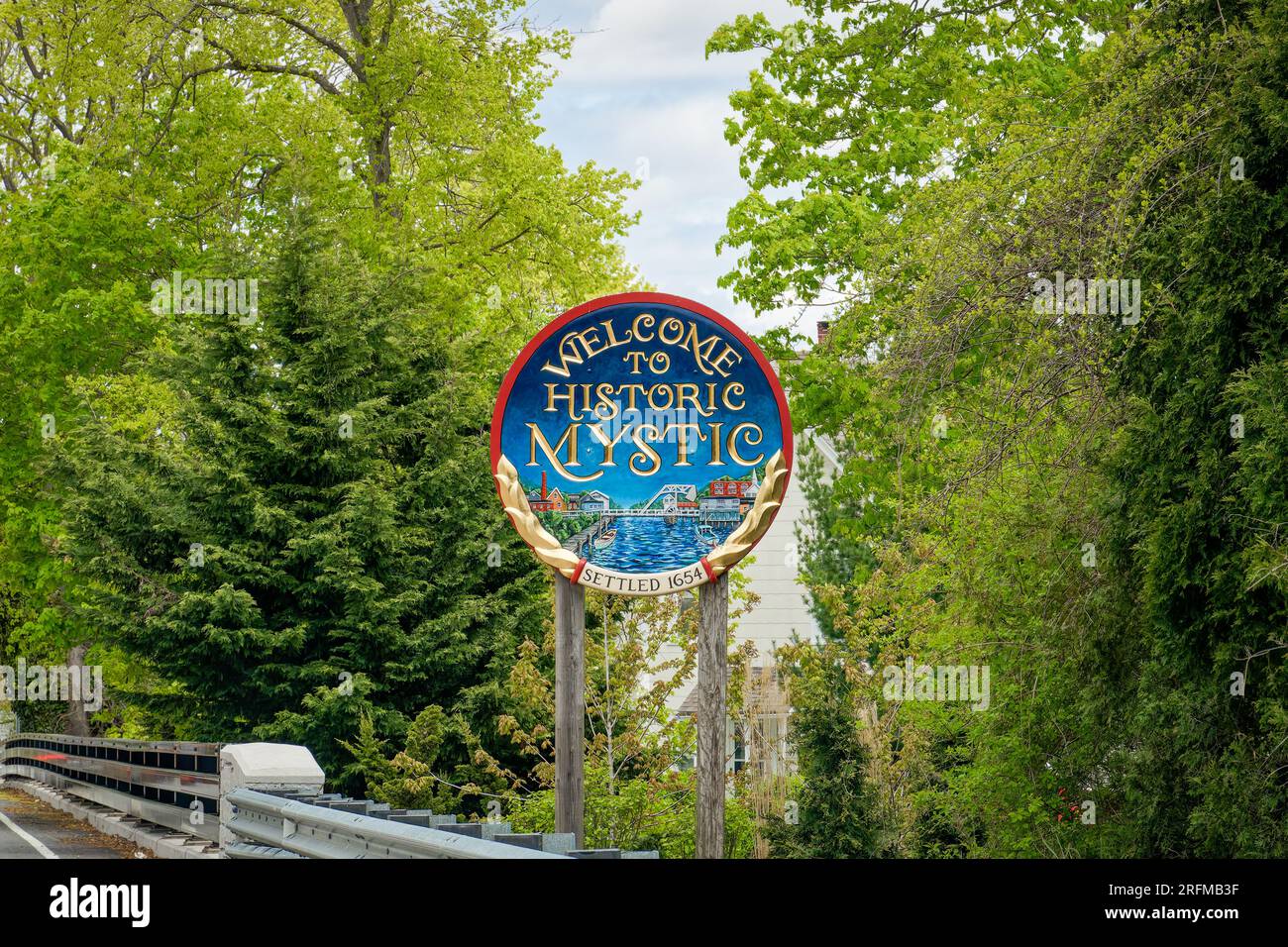 Mystic, CT - May 4, 2023: This is one of the 4 hand carved wooden signs that welcome you to the town of Mystic, Connecticut when you enter from any di Stock Photo