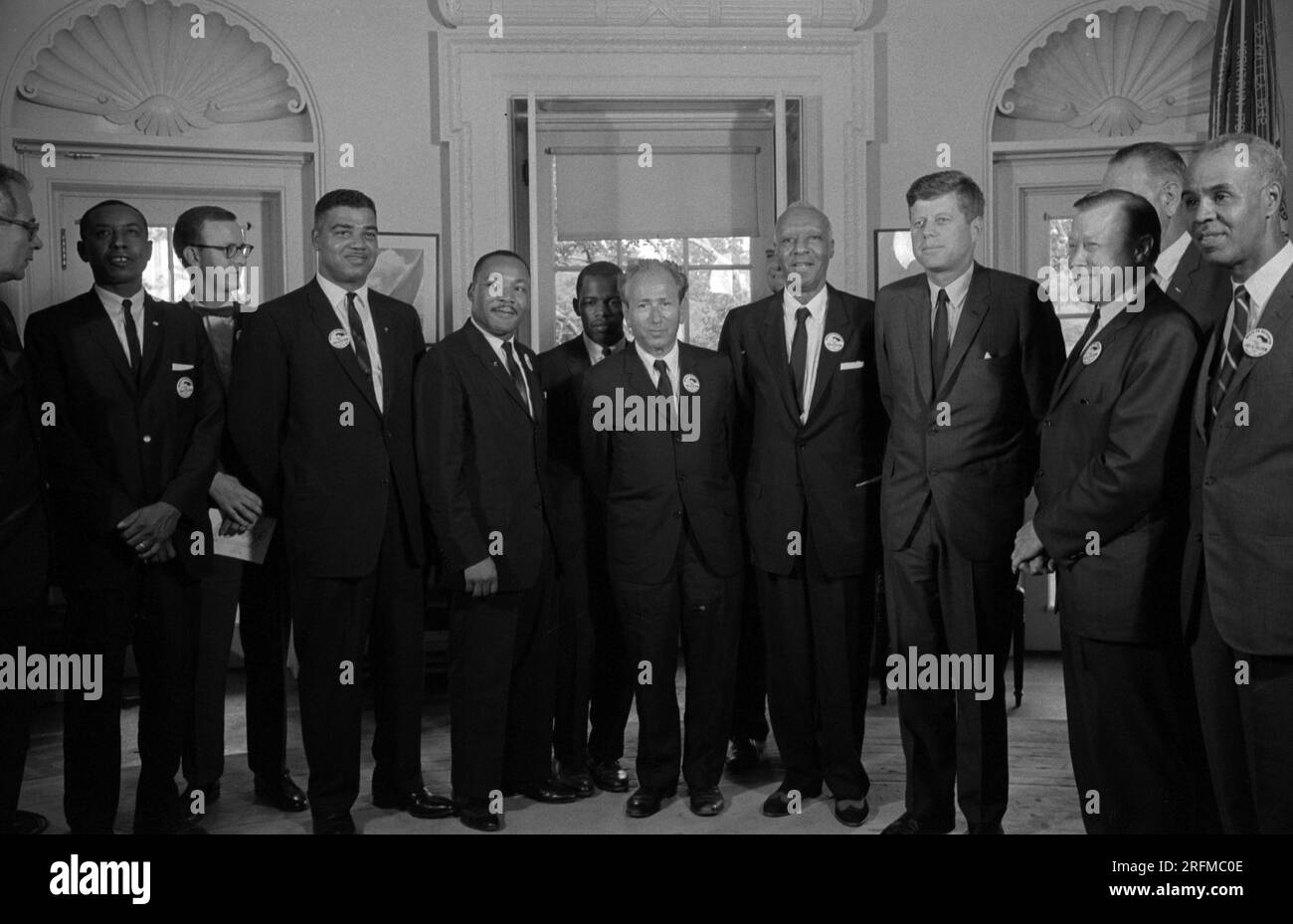 Civil rights leaders meet with President John F. Kennedy in the oval office of the White House after the March on Washington; D.C. Photograph shows (left to right): Willard Wirtz (Secretary of Labour); Floyd McKissick (CORE); Mathew Ahmann (National Catholic Conference for Interracial Justice); Whitney Young (National Urban League); Martin Luther King; Jr.(SCLC); John Lewis (SNCC); Rabbi Joachim Prinz (American Jewish Congress); A. Philip Randolph; with Reverend Eugene Carson Blake partially visible behind him; President John F. Kennedy; Walter Reuther (labour leader); with Vice President Lynd Stock Photo
