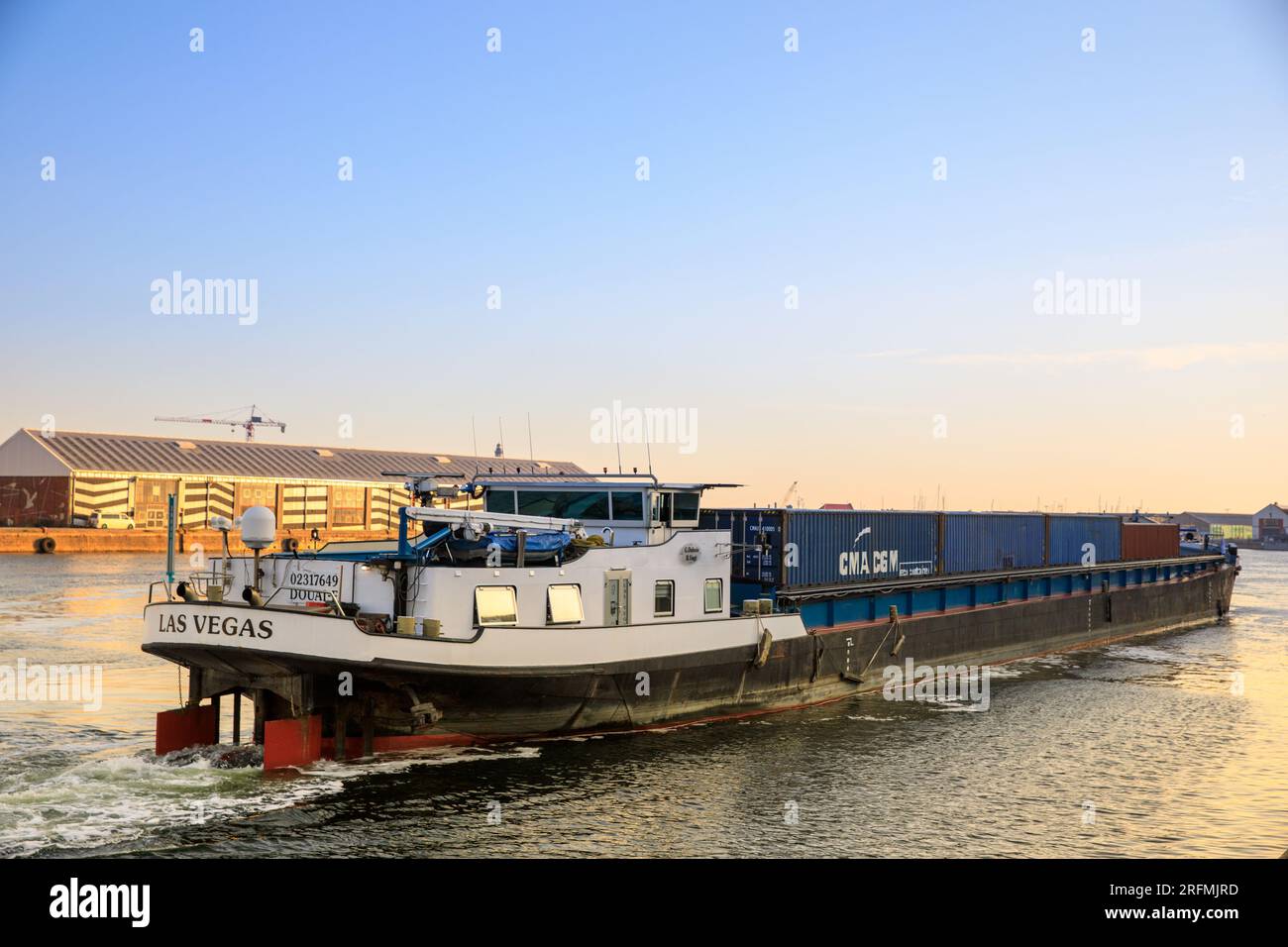 France, Hauts-de-France region, Nord department, Dunkirk, port area, barge manoeuvring Stock Photo