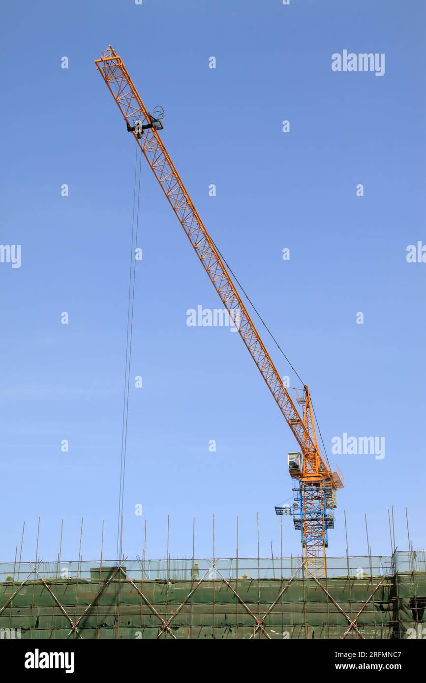 tower crane under the blue sky in a site Stock Photo - Alamy