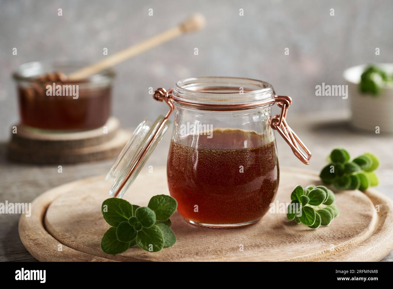 Coleus amboinicus syrup for common cold with fresh leaves on a table Stock Photo