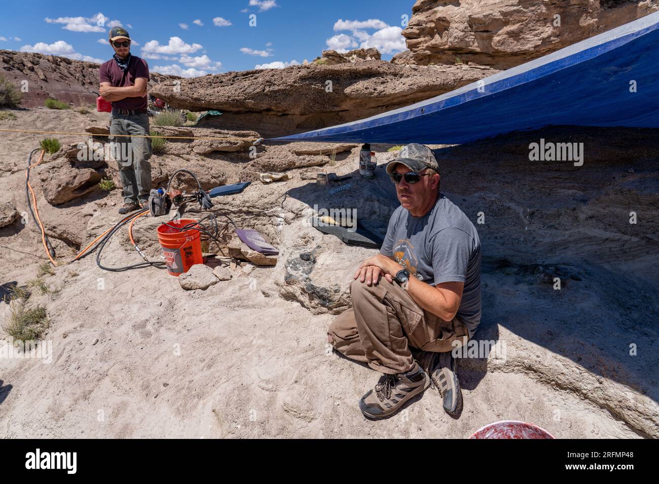 Paleontologists work in the Morrison Formation in the Burpee Dinosaur Quarry in the Caineville Desert near Hanksville, Utah. Stock Photo