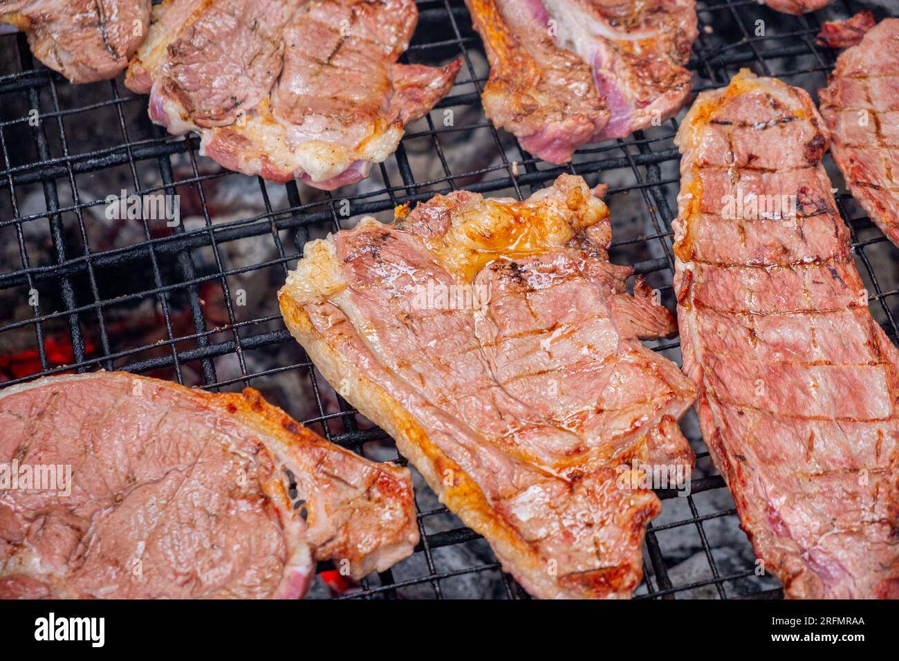 pieces of beef roasted on a charcoal grill Stock Photo Alamy