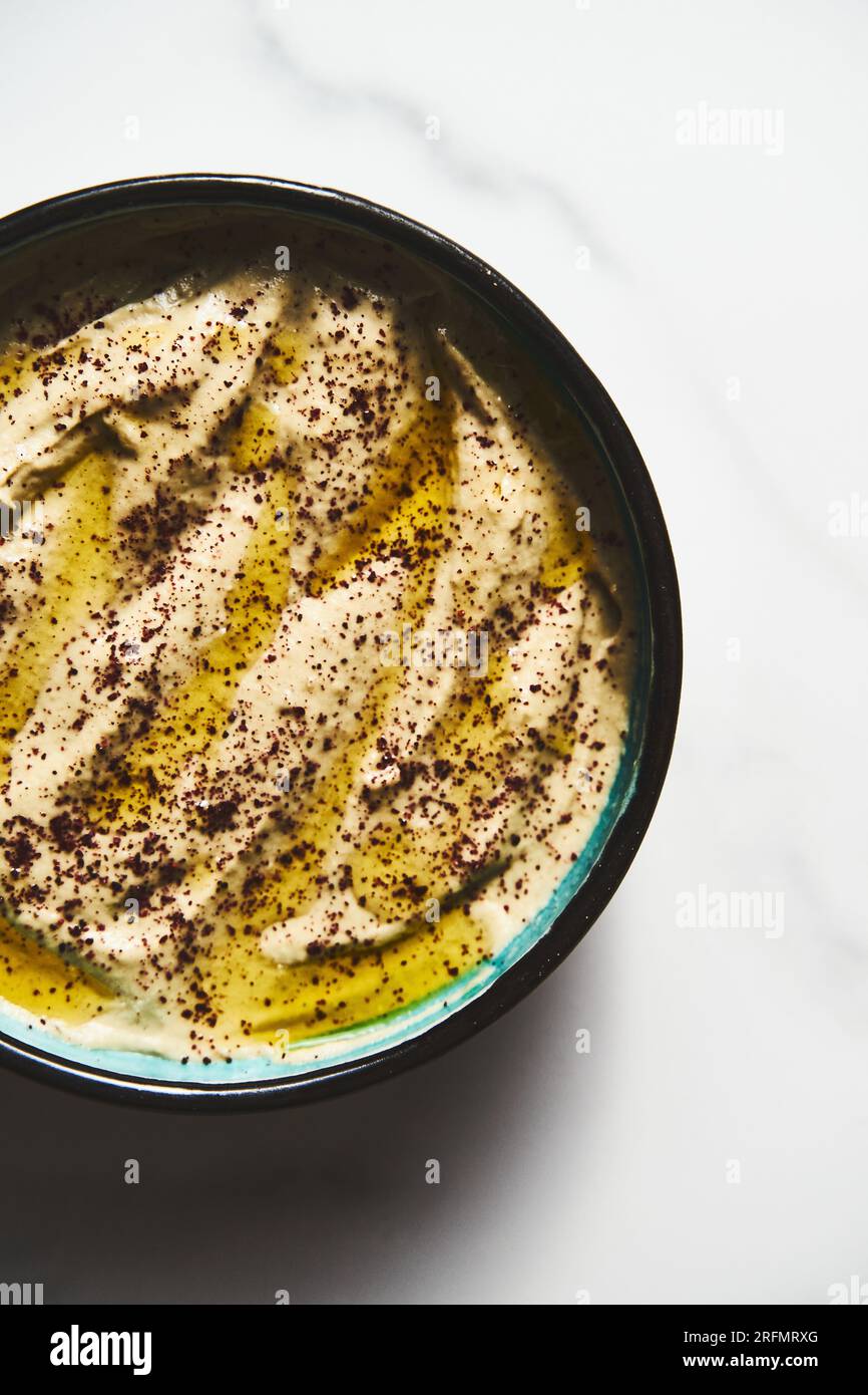 Mutabal or Moutabal - Middle Eastern dip made from roasted eggplants with tahini, garlic and lemon juice. It's creamy, smoky, and tangy. Stock Photo