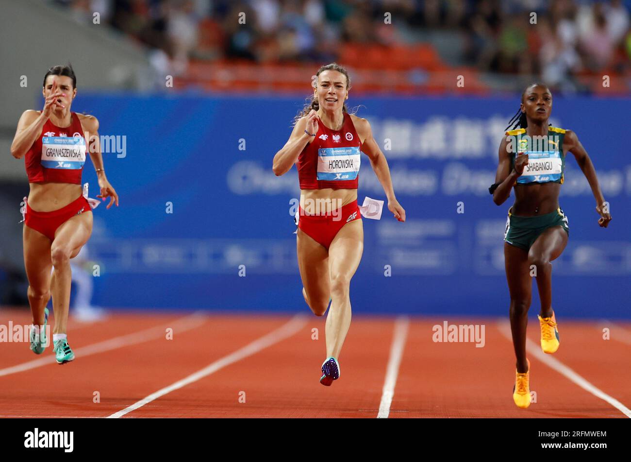 Chengdu, China's Sichuan Province. 4th Aug, 2023. Gold medalist Nikola Horowska (C) of Poland, Silver medalist Marlena Granaszewska (L) of Poland and bronze medalist Banele Withney Shabangu of South Africa compete during the Women's 200m Final of athletics at the 31st FISU Summer World University Games in Chengdu, southwest China's Sichuan Province, Aug. 4, 2023. Credit: Jia Haocheng/Xinhua/Alamy Live News Stock Photo
