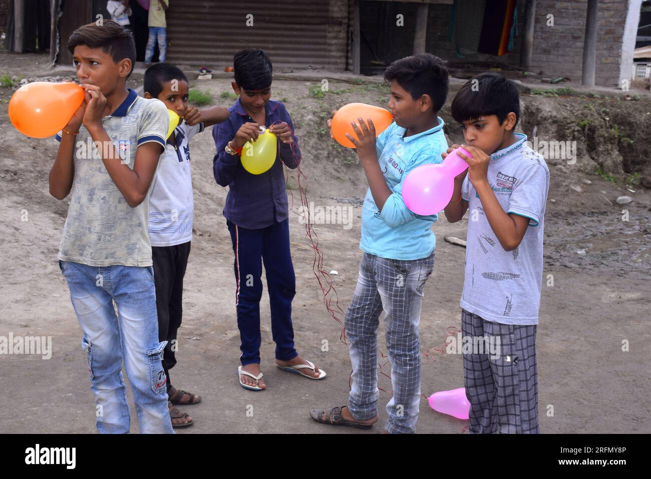 12-08-2020 Dewas, Madhya Pradesh, India. rural children playing balloons, slum boys, birthday concept Stock Photo