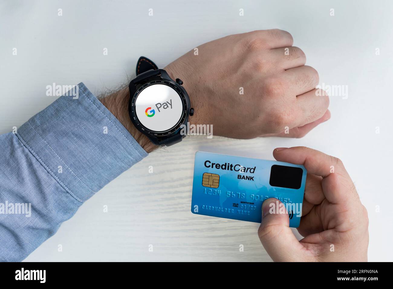 Google Pay, G Pay logo on the smart watch and the credit card template. October 31, 2022. Barnaul Russia Stock Photo