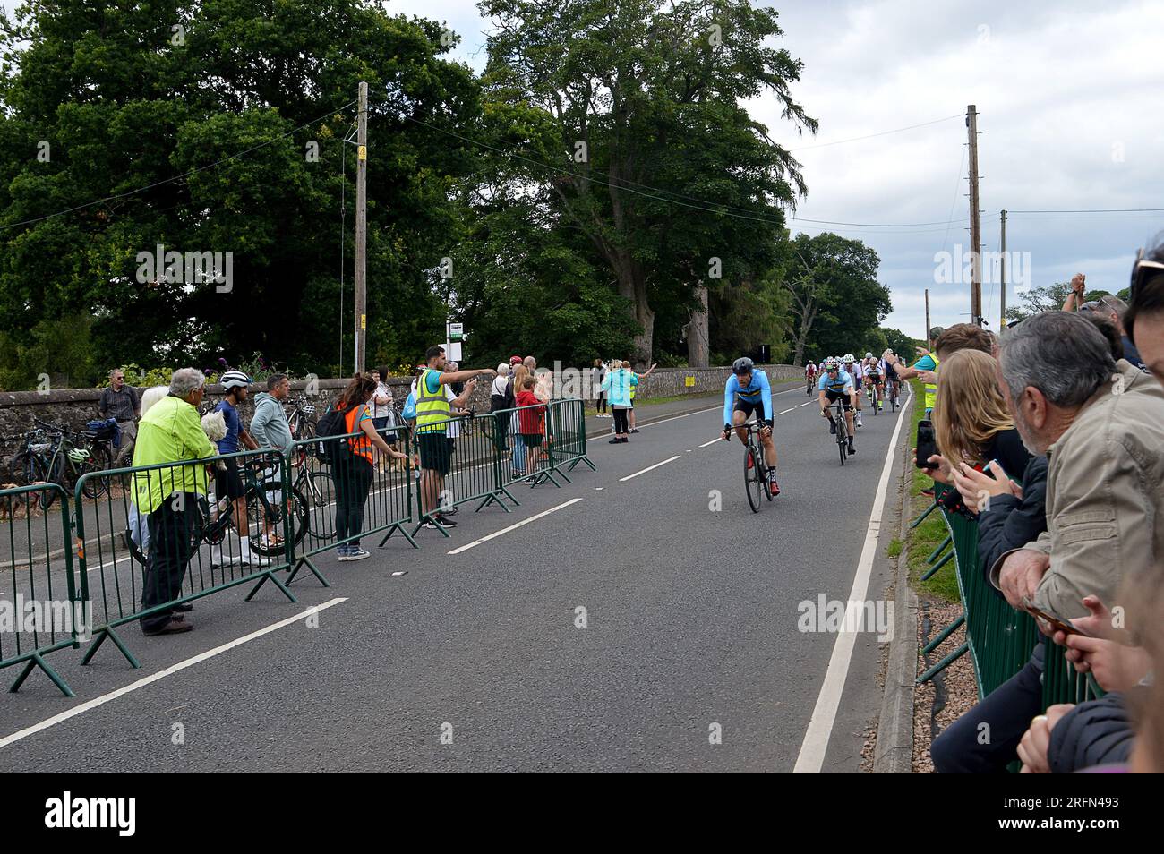 PERTH, SCOTLAND - 4 AUGUST 2023: Riders enter Scone Palace Grounds for the finish of the 160km Gran Fondo cycle race at the 2023 UCI World Championships in Glasgow, Scotland Stock Photo