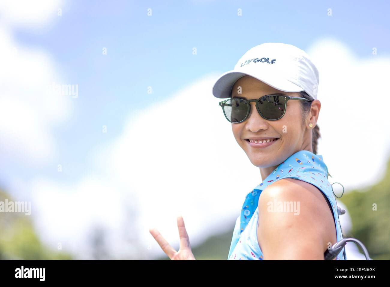 Su-Ann Heng, LIV Golf Broadcaster, looks on from the driving range