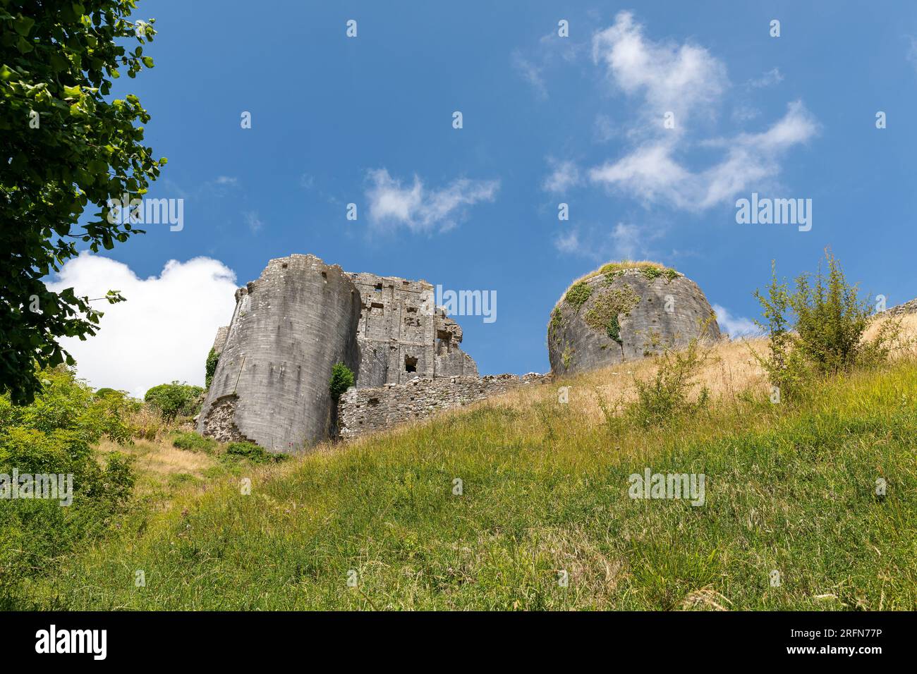 Different view of Corfe Castle on the Isle of Purbeck Dorset. Looking up from the public footpath around the base of the hill. Stock Photo