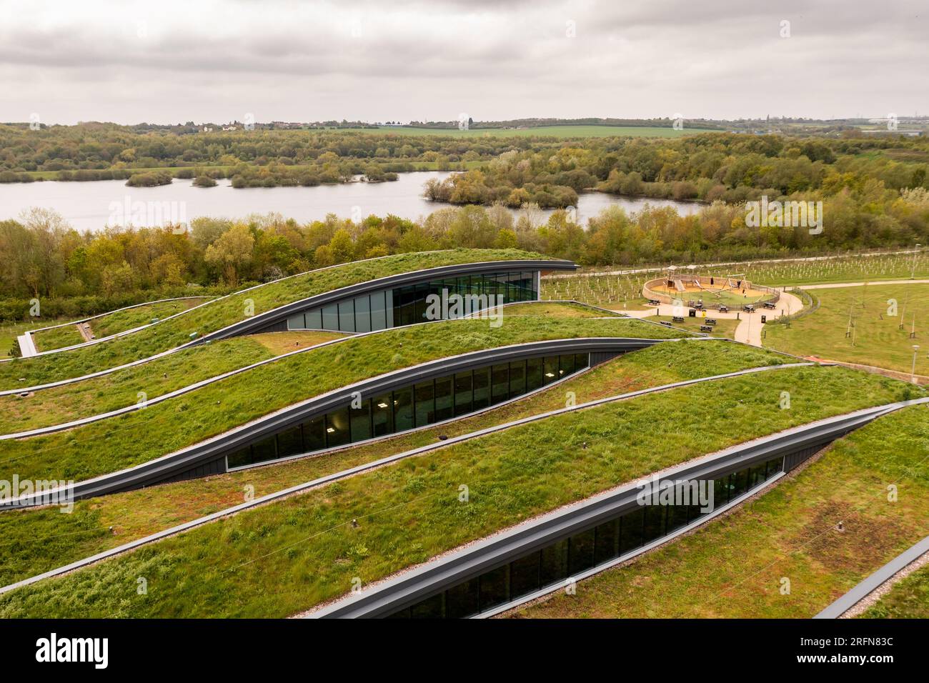 Aerial view of the extensive wildflower green roof or living roof on the net zero rooftop of a green building owned by a responsible business Stock Photo
