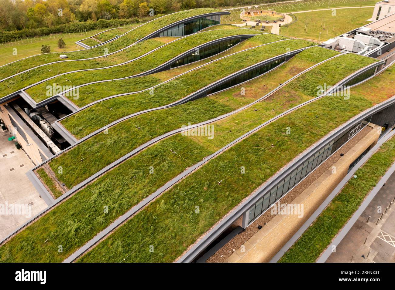 Aerial view of the extensive wildflower green roof or living roof on the net zero rooftop of a green building owned by a responsible business Stock Photo