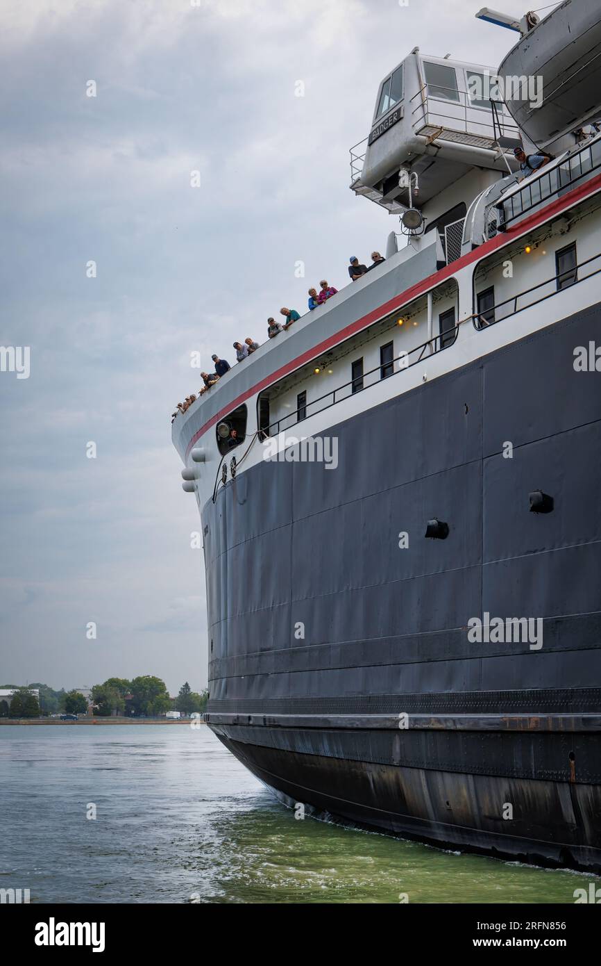 Passengers aboard the SS Badger, looking over the side, as the ship