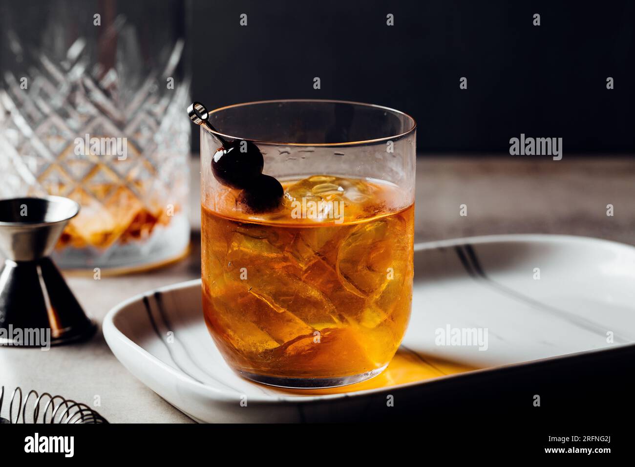 Alcoholic Manhattan Drink on the rocks Bourbon Whiskey and garnish with
