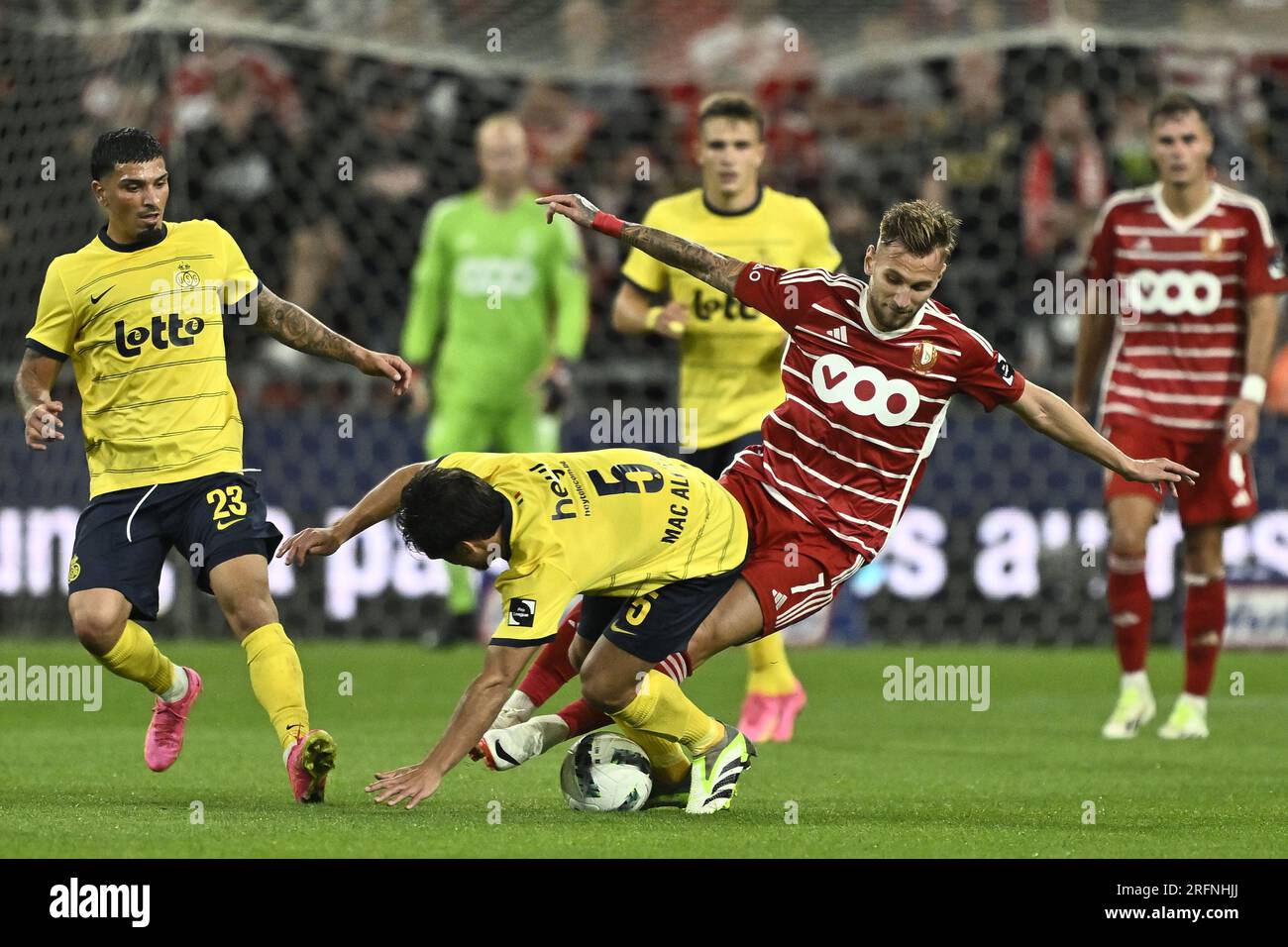 Liege, Belgium. 04th Aug, 2023. Union's Kevin Mac Allister and Standard's  Denis Dragus fight for the ball during a soccer match between Standard de  Liege and Royale Union SG, Friday 04 August