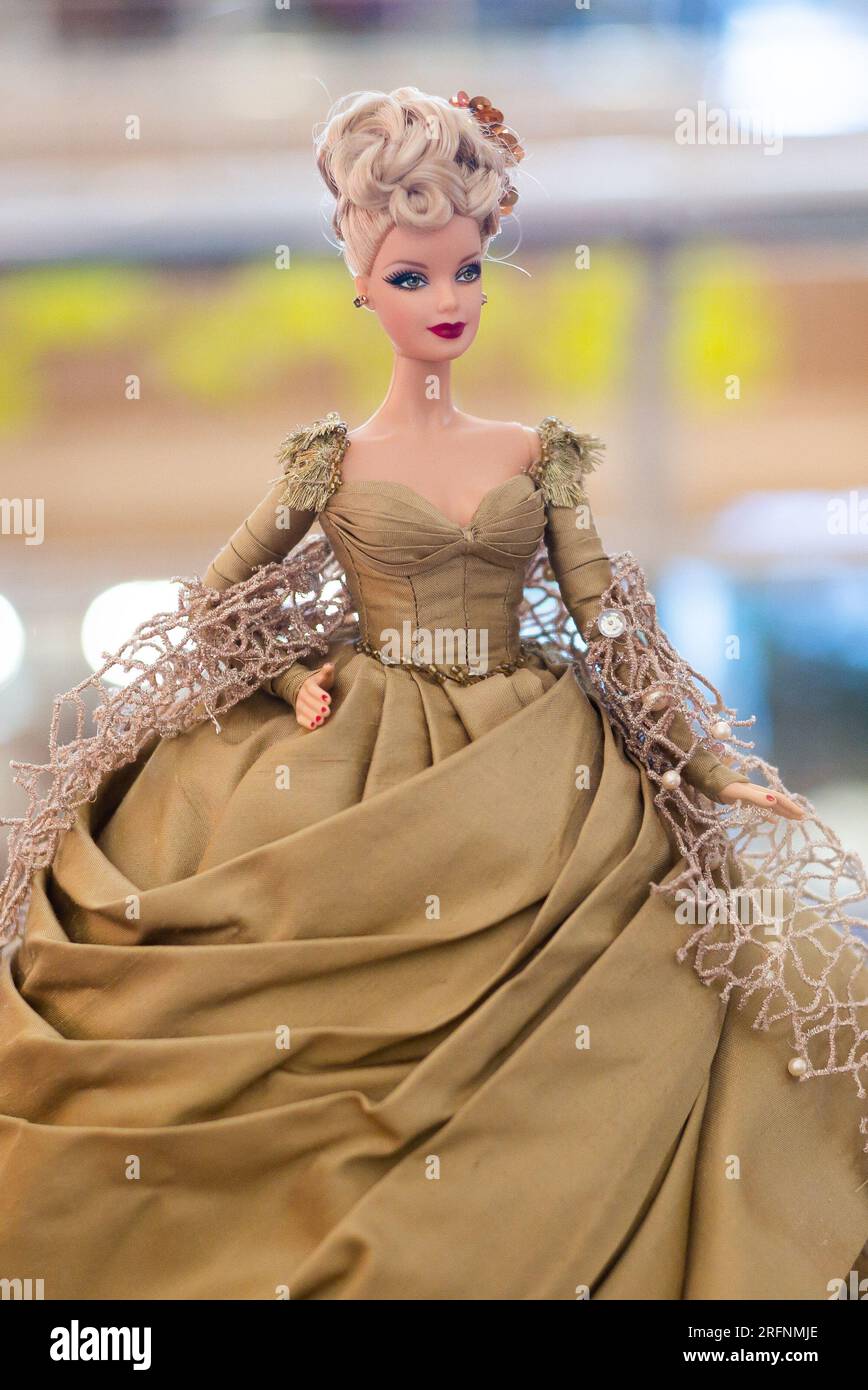 A Barbie doll is displayed at the 'Barbie Film and Fashion' exhibition, more than 200 Barbie dolls, paying homage to show business and fashion, on Aug Stock Photo