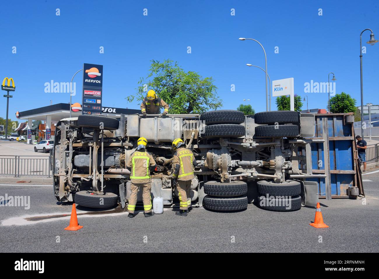 August 4, 2023, Roda de BerÃ, Tarragona, Spain: Firefighters from the government of Catalonia work on the accident of a truck in Roda de BerÃ Tarragona Spain. A truck from an excavation company has overturned loaded with stones, brushwood on the National Highway in Roda de BerÃ . Crews from the Government of Catalonia firefighters, the Local Police of Roda de BerÃ reached the scene of the accident and found no victims or injuries and the driver has emerged unharmed from the accident, the accident has caused retentions of 7 km on the national highway N-340. (Credit Image: © Ramon Costa/SOPA I Stock Photo