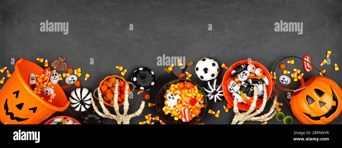 Halloween trick or treat bottom border with jack o lantern pails and ...