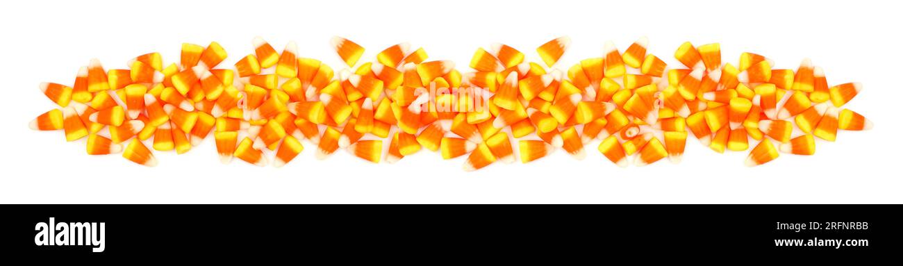 Halloween candy corn border banner. Top view isolated on a white background  Stock Photo - Alamy