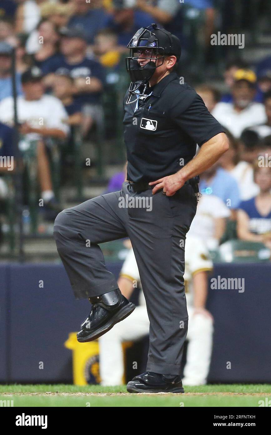 MILWAUKEE, WI - AUGUST 03: Home Plate umpire Chris Guccione (68) stretches after getting hit by a pitch during a game between the Milwaukee Brewers and the Pittsburgh Pirates at American Family Field on August 3, 2023 in Milwaukee, WI. (Photo by Larry Radloff/Icon Sportswire) (Icon Sportswire via AP Images) Stock Photo
