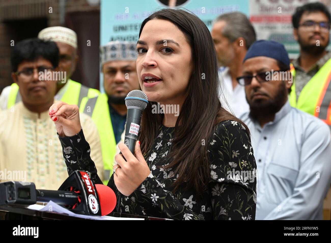 New York, USA. 04th Aug, 2023. Rep. Alexandria Ocasio-Cortez speaks before distributing food to people suffering from food insecurities at the Parkchester Islamic Center in the New York City borough of the Bronx, NY, August 4, 2023. Rep. Ocasio-Cortez outlined her efforts to increase access to halal and kosher food in the 2023 federal ‘Farm bill', as Muslim and Jewish families struggle to afford food that meets their faith's dietary guidelines. (Photo by Anthony Behar/Sipa USA) Credit: Sipa USA/Alamy Live News Stock Photo