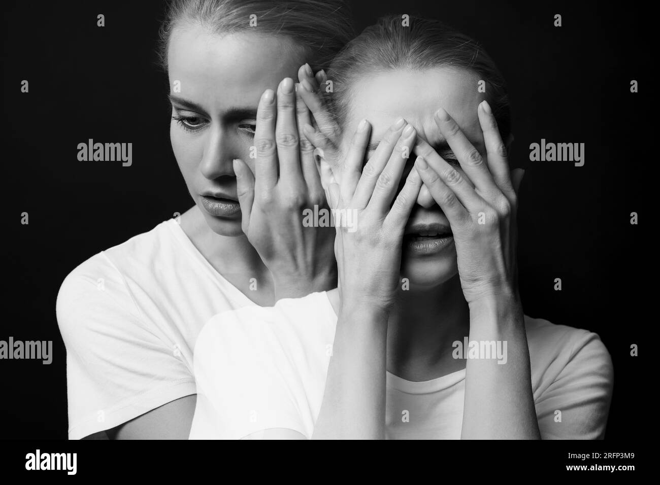 Suffering from hallucinations. Double exposure with photos of woman on dark background, black and white effect Stock Photo