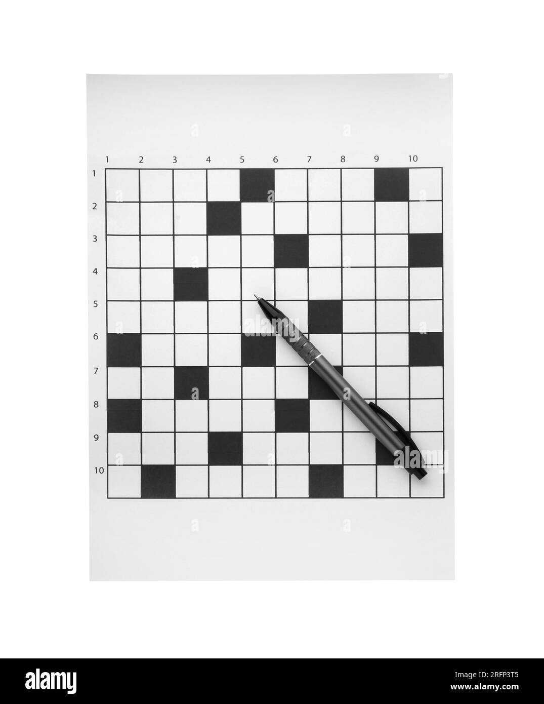 Blank crossword and pen on white background, top view Stock Photo