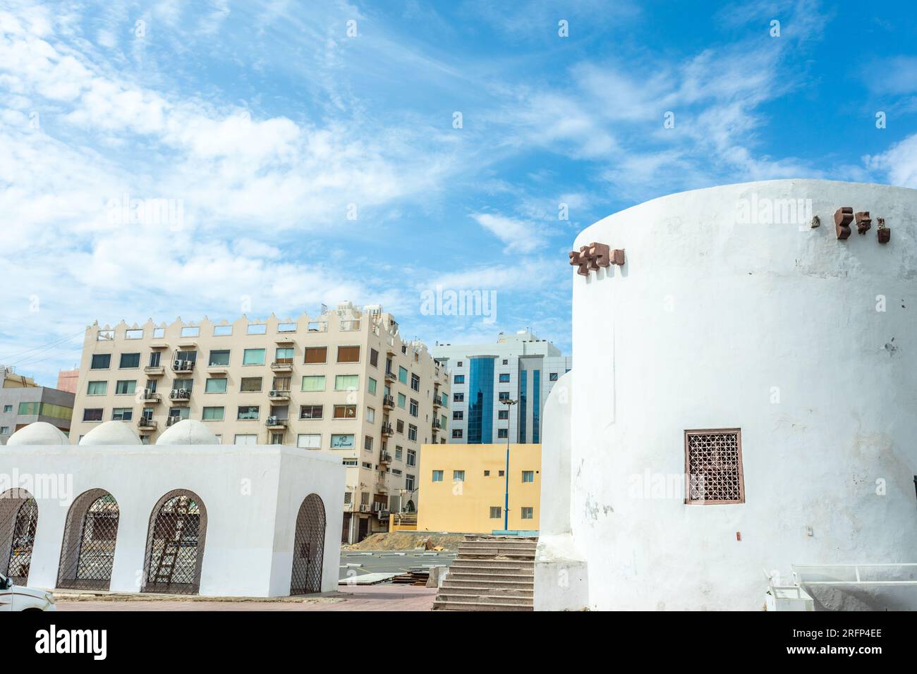 Al-Balad old town fortress remains with modern buildings, Jeddah, Saudi Arabia Stock Photo