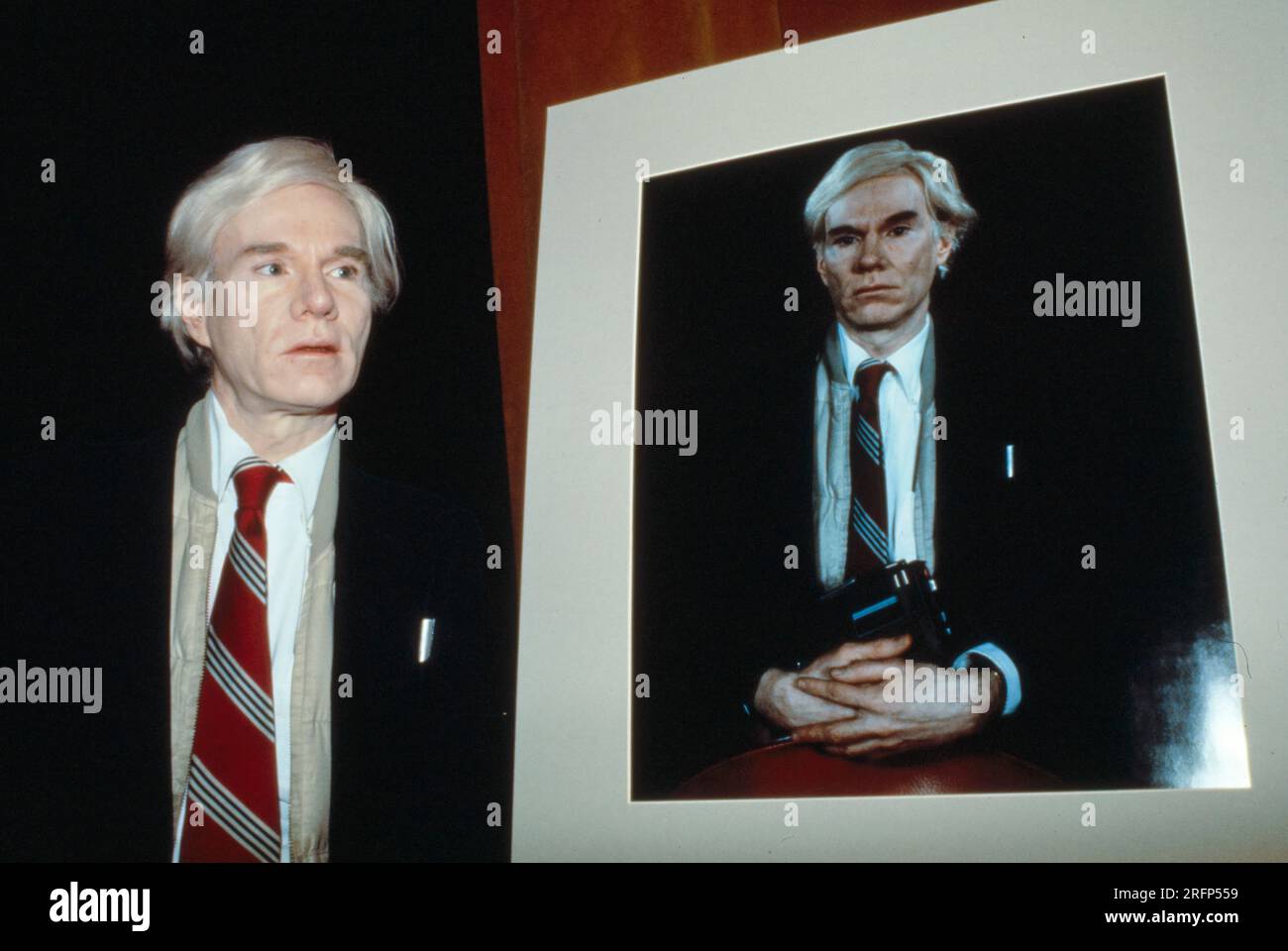 Pop artist Andy Warhol with a large format 20 x 24 Polaroid print ...