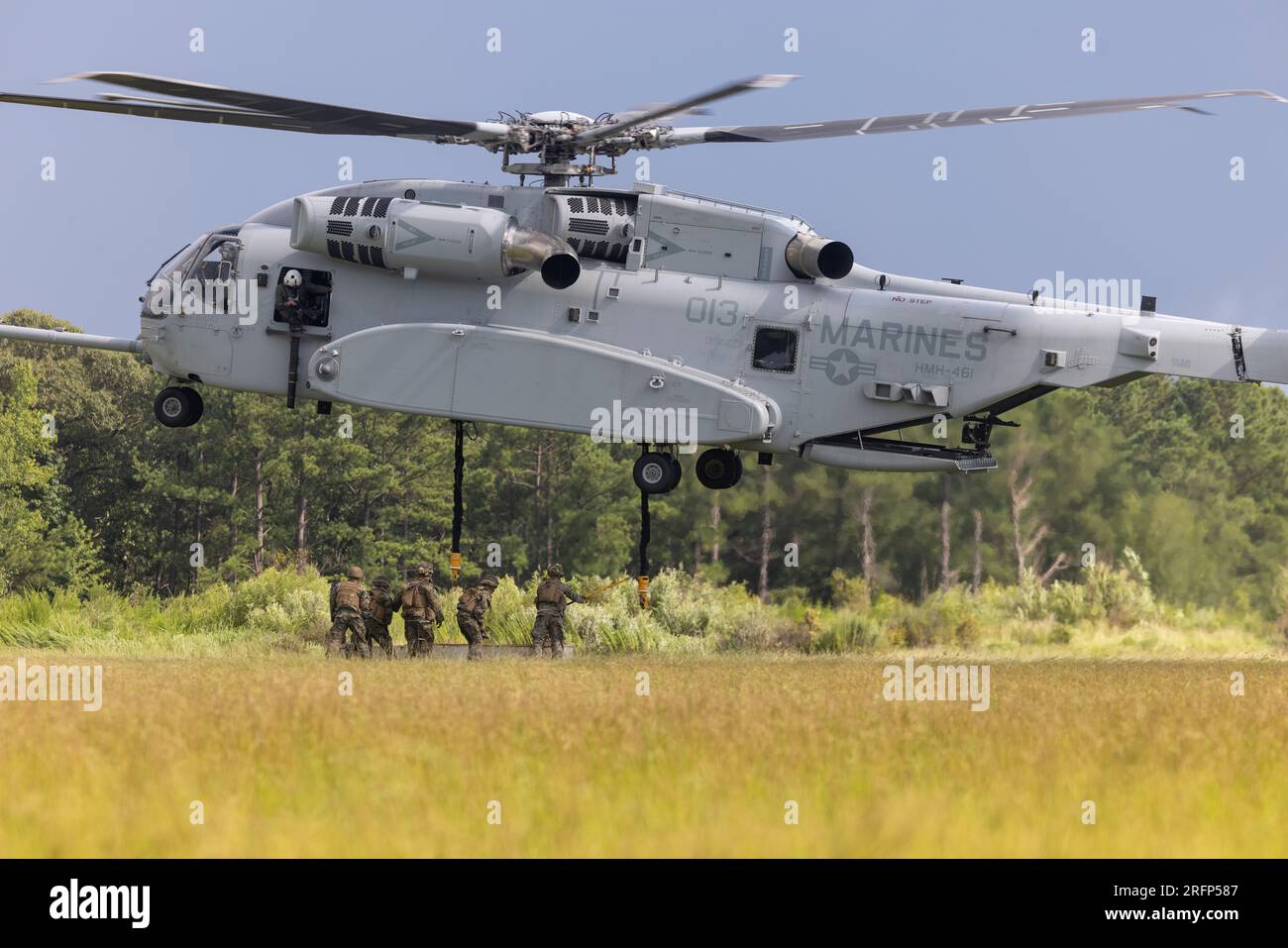 U.S. Marines with Combat Logistics Battalion 24 (CLB-24), Combat Logistics Regiment 2, 2nd Marine Logistics Group, and Marines with Marine Heavy Helicopter Training Squadron 302, conduct helicopter support team operations during their Marine Corps Combat Readiness Evaluation (MCCRE) on Camp Lejeune, North Carolina, Aug. 1, 2023. CLB-24’s MCCRE is the battalion's final evaluation to demonstrate combat readiness through proficiency in core mission essential tasks before they begin a change of operational control to the 24th Marine Expeditionary Unit. (U.S. Marine Corps Photo by Lance Cpl. Jessic Stock Photo