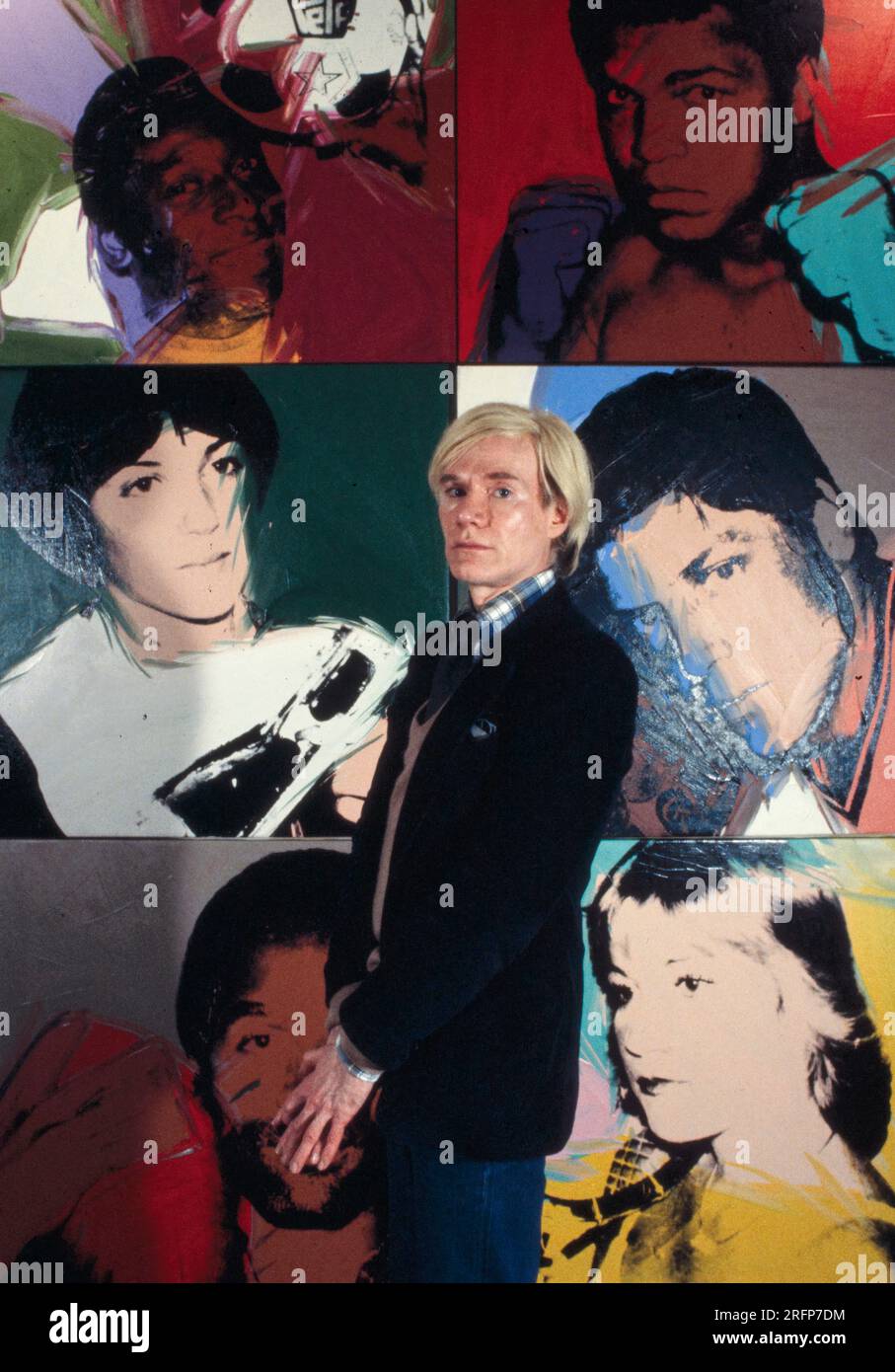 Andy Warhol in a NY gallery with his art portraits in 1975. Warhol was