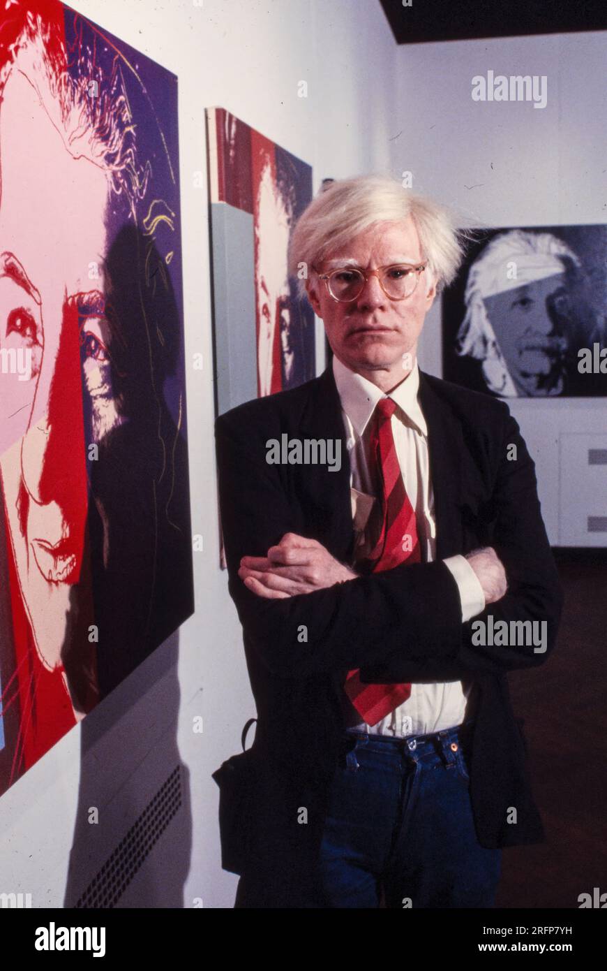 Andy Warhol in a NY gallery with his art portraits in 1975. Warhol was