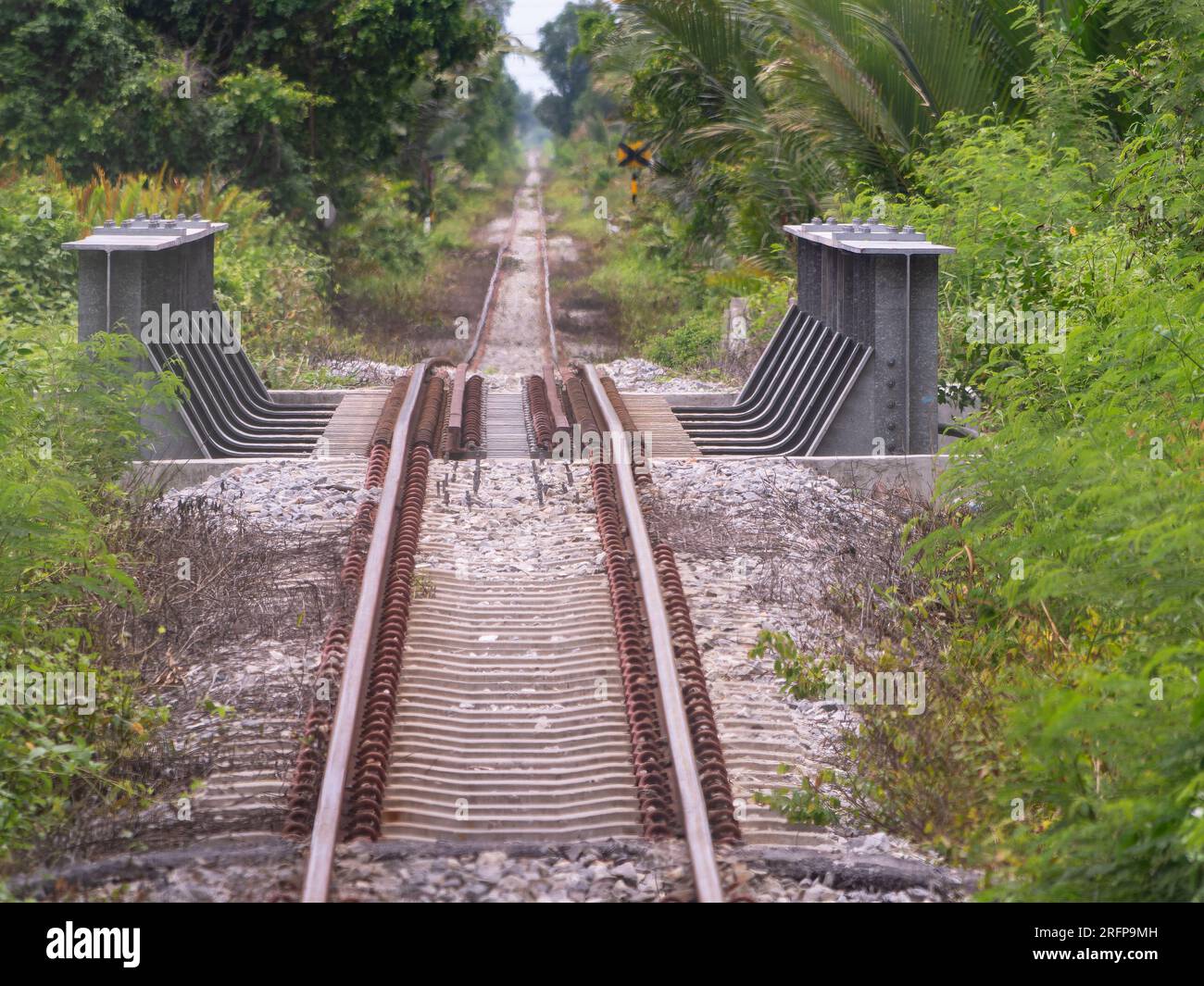 Small railway bridge on the Ban Laem - Mae Klong railway line in Thailand, going through sparsely populated areas between Ban Laem in Samut Sakhon and Stock Photo