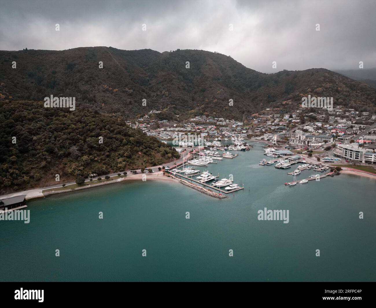 A drone shot taken above the ocean looking back into land at Picton's