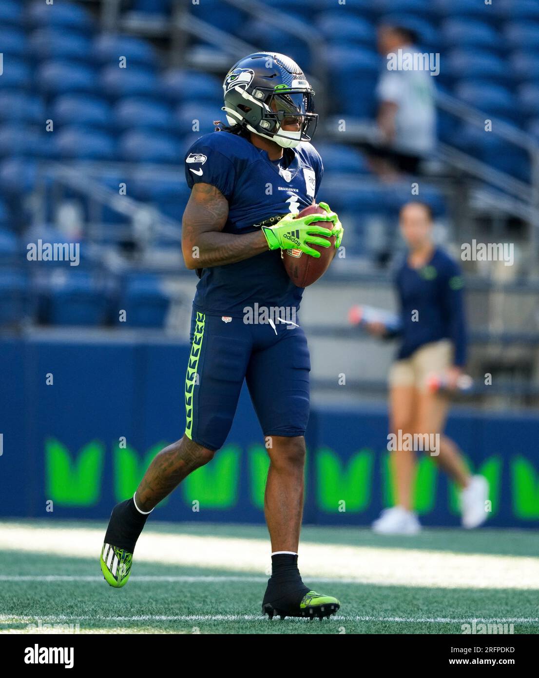 Seattle Seahawks wide receiver Dee Eskridge kneels on the field