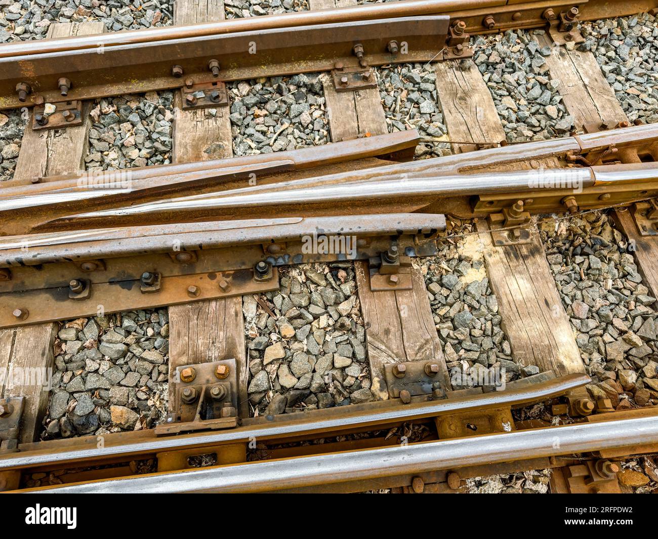 railway switch of narrow gauge railway tracks. detailed closeup view. Stock Photo