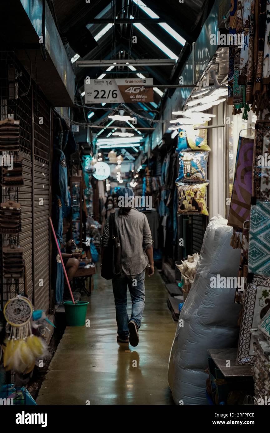 A man walking in alley Stock Photo