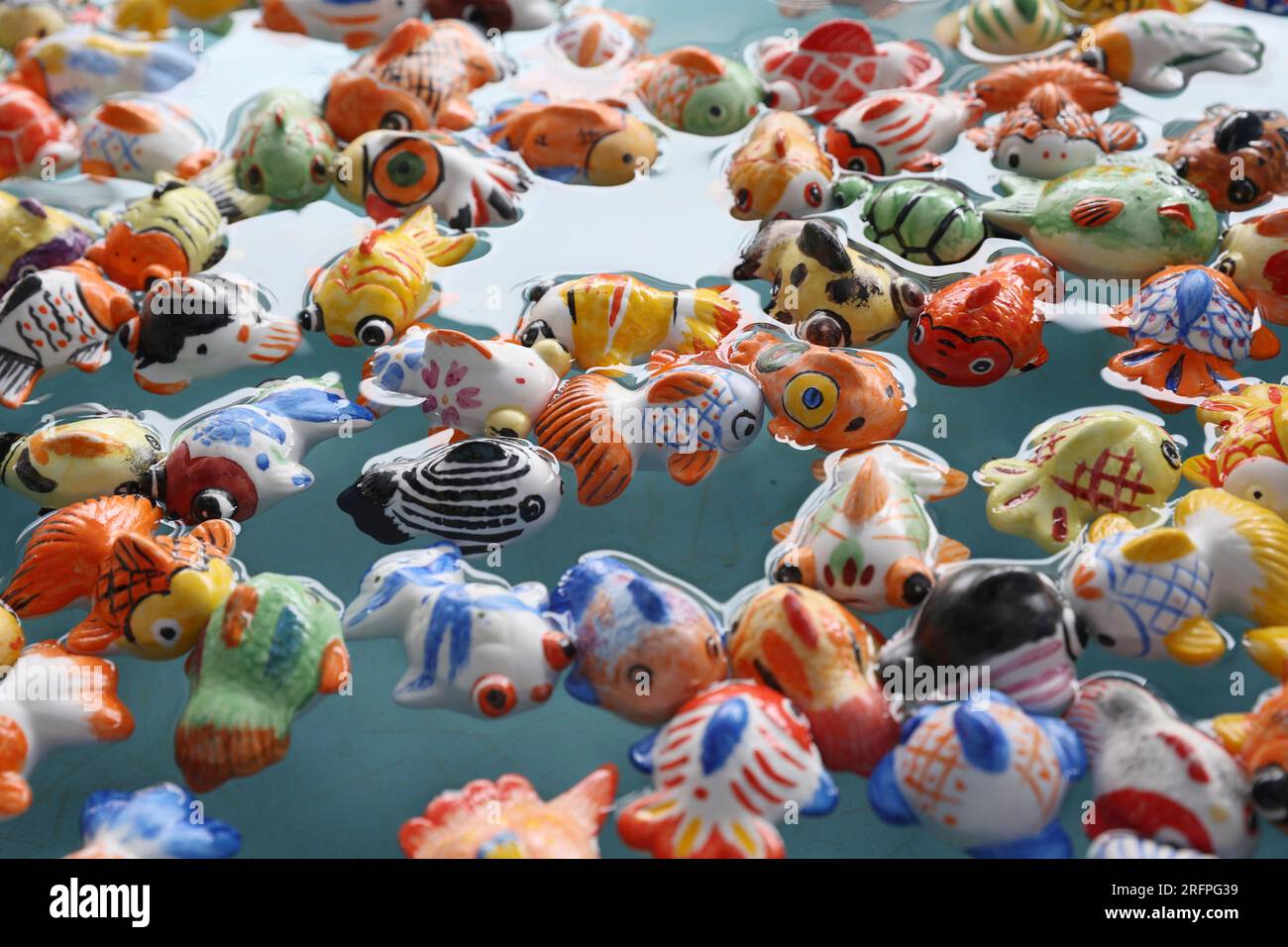 People enjoy scooping pottery-made goldfish in Seto, Aichi