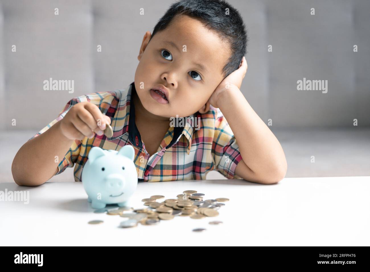 Preschooler child learning to calculate personal budget, manage finance