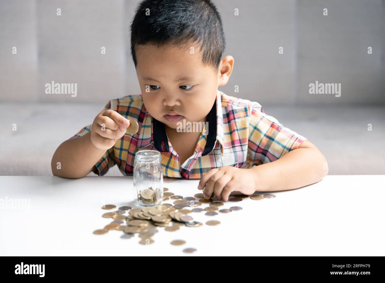 Preschooler child learning to calculate personal budget, manage finance