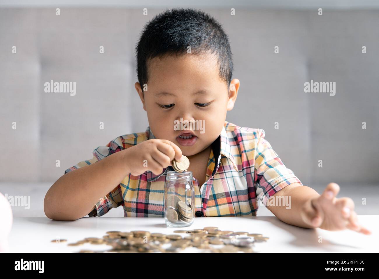 Preschooler child learning to calculate personal budget, manage finance