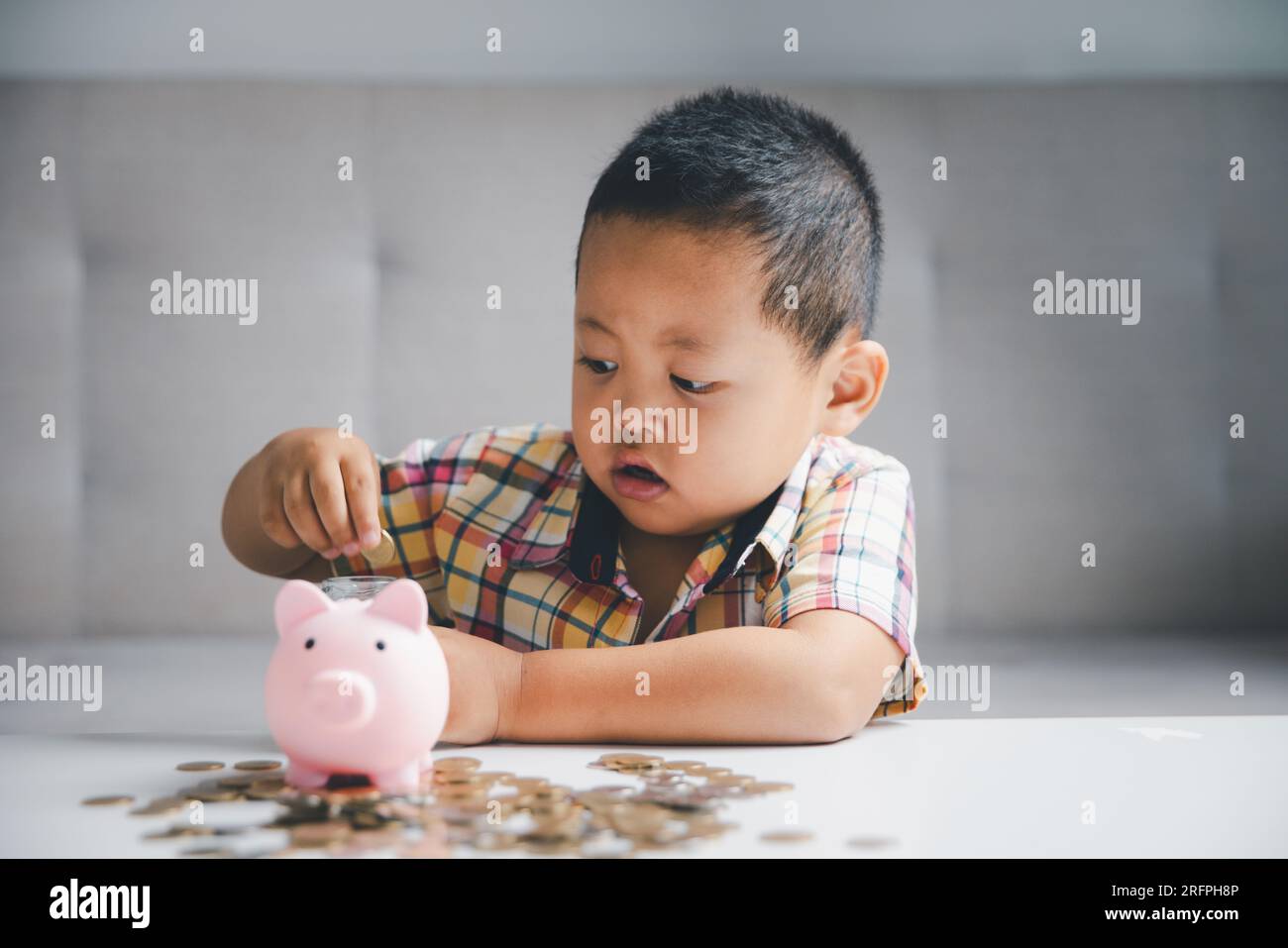 Preschooler child learning to calculate personal budget, manage finance