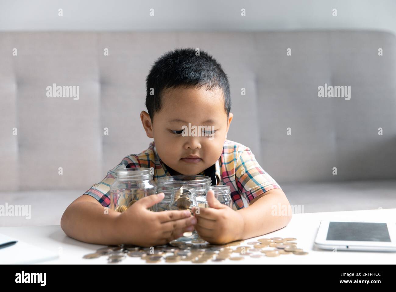 Preschooler child learning to calculate personal budget, manage finance